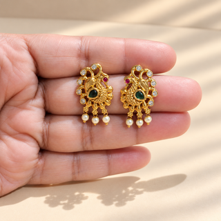 Beatrix gold finish multicolour Indian stud earrings green stones and pearl drops close-up