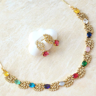 Necklace with colorful gemstones on a textured beige surface
