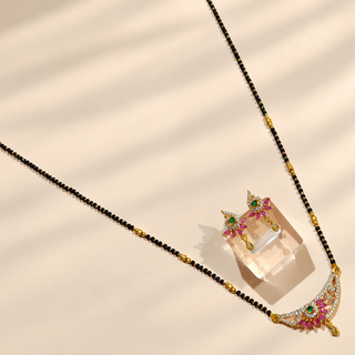 Phoebe black bead mangalsutra necklace set and matching earrings angled flat lay