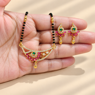 Phoebe gold tone curved floral mangalsutra pendant and matching earrings close-up on hand