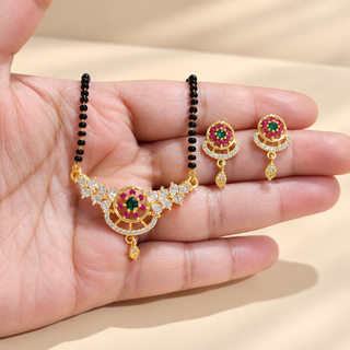 Amelia floral black bead mangalsutra necklace and matching earrings displayed on hand