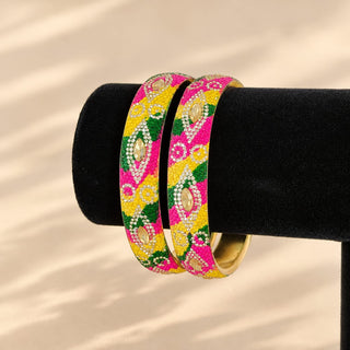 Poppy colourful Indian imitation jewellery bangles displayed on black stand