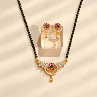 Amelia gold tone black bead mangalsutra and matching floral earrings jewellery flat lay