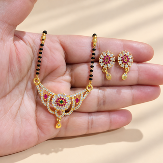 Olivia mangalsutra necklace and matching earrings displayed in hand for scale