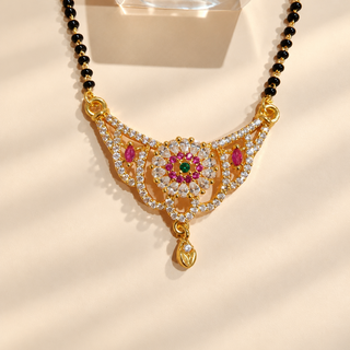Olivia gold finish mangalsutra pendant close-up with pink green and white stones