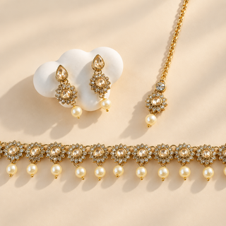 Aavika Polki gold choker necklace set with ivory pearl drops, earrings and maang tikka - view 1