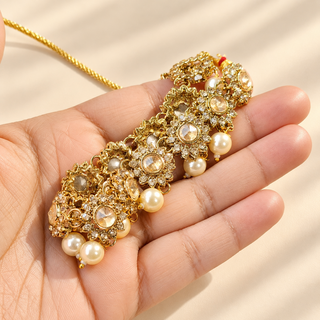 Aavika Polki gold choker necklace set with ivory pearl drops, earrings and maang tikka - view 3