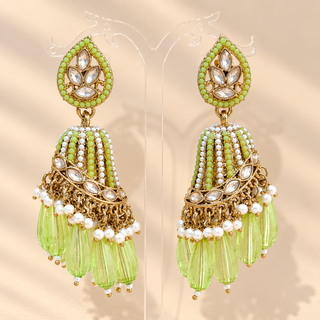 Adeline light green polki jhumka earrings with gold finish, pale green beads, white pearl accents and translucent green drops on display stand