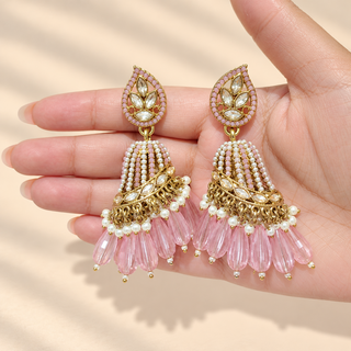 Adeline pastel pink Indian polki jhumka earrings held in hand showing pale pink and white beaded domes and pink drops