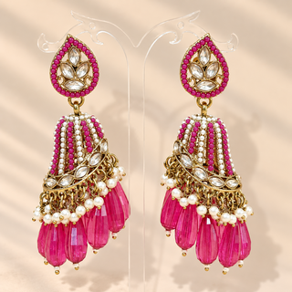 Adeline rani pink polki jhumka earrings gold finish with pink bead drops and pearl accents on display stand