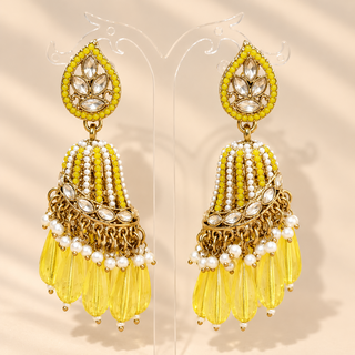 Adeline yellow polki jhumka earrings in gold finish with yellow teardrop beads and white pearl-like accents on stand