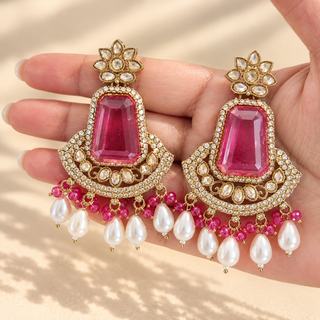Beatrix pink polki statement earrings 7.5 cm with pink beads and pearl drops shown in hand