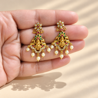 Winifred multicolour Indian temple earrings held in hand size reference