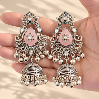 Cressida light pink oxidised silver kundan style jhumka earrings with blush pink teardrop stones photographed in hand