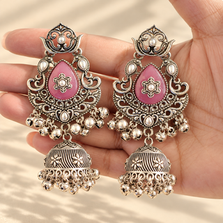 Cressida lilac purple oxidised silver jhumka earrings with pink-lilac teardrop stones and ghungroo bells in hand