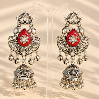 Cressida maroon red German silver oxidised kundan jhumka earrings 8.5 cm with dark red teardrop stones and ghungroo bells on display stand