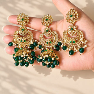 Dovey green polki jhumka earrings 9 cm and matching maang tikka with white and green beads held in hand