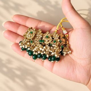 Dovey green polki necklace close up with floral clear stones green beads and gold finish held in hand