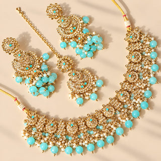 Dovey pastel blue polki necklace set with matching jhumka earrings and maang tikka gold finish full set