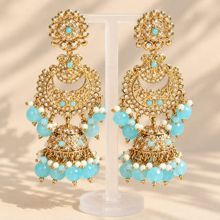 Dovey matching 9 cm pastel blue polki jhumka earrings gold finish on jewellery stand