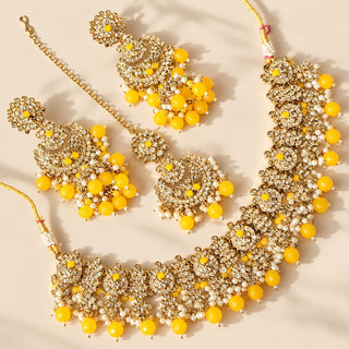 Dovey yellow polki necklace set gold finish with matching jhumka earrings and maang tikka yellow bead drops