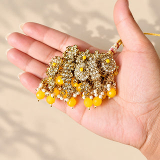 Dovey yellow polki necklace gold finish floral clear stone detailing and yellow beads held in hand