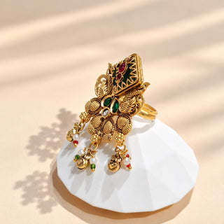 Eglantine multicolour Indian Kemp statement ring gold finish with diamond-shaped dark green centre red and green ornamental stones bird motifs and hanging charms photo 1