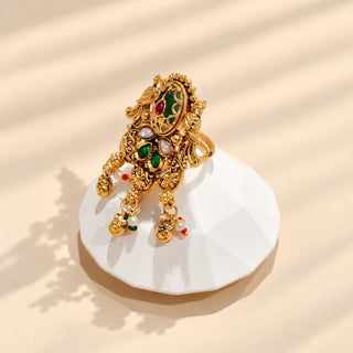 Euphemia multicolour Indian Kemp statement ring in gold finish, ornate green enamel-look centre with red and green stones and white bead dangling charms, image 3