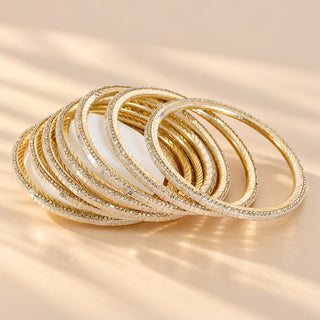 Euphrasia set of eight gold finish slim Indian artificial stacking bangles with pearly white reflective accents crystal-look sparkle photo 1