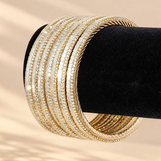 Euphrasia set of eight gold finish slim Indian artificial stacking bangles with pearly white reflective accents crystal-look sparkle photo 2