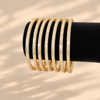 Euphrasia set of eight gold finish slim Indian artificial stacking bangles with pearly white reflective accents crystal-look sparkle photo 3