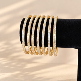 Euphrasia set of eight gold finish slim Indian artificial stacking bangles with pearly white reflective accents crystal-look sparkle photo 4