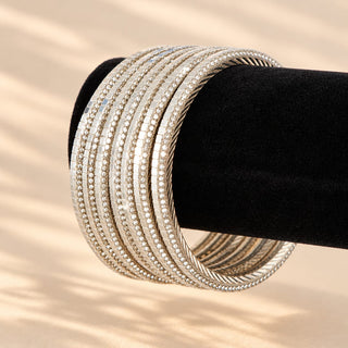 Euphrasia silver mother of pearl shine stackable bangles on black display close up
