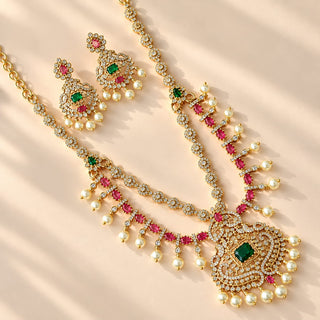 Evangeline multicolour CZ diamond simulant gold finish Indian necklace set green and rani pink stones white pearl drops matching 4 cm earrings photo 1