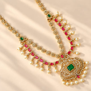 Evangeline multicolour CZ diamond simulant gold finish Indian necklace set green and rani pink stones white pearl drops matching 4 cm earrings photo 2