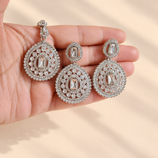Close up Florence silver polki choker set matching earrings and maang tikka with clear decorative stones