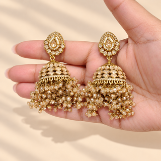 Florence Victorian gold polki matching 7 cm jhumka earrings held in hand