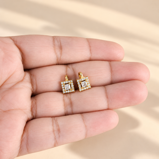Georgina square halo diamond simulant gold bugadi earrings shown in palm
