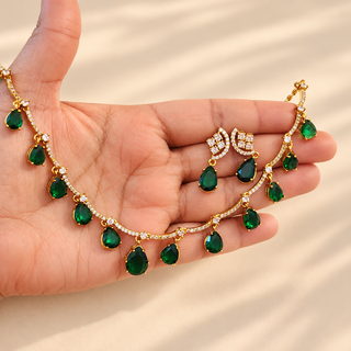 Imogen Indian artificial jewellery dark green CZ diamond necklace set with matching earrings shown in hand