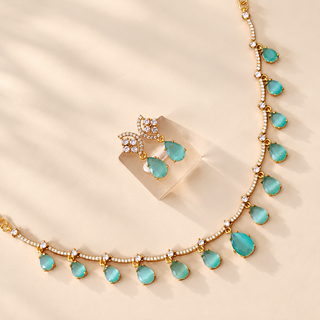 Imogen mint green gold tone artificial necklace set and matching earrings closeup