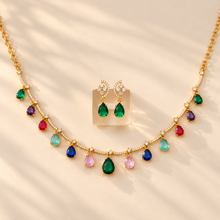 Imogen multicolour artificial CZ diamond necklace and matching 3 cm green earrings on beige background