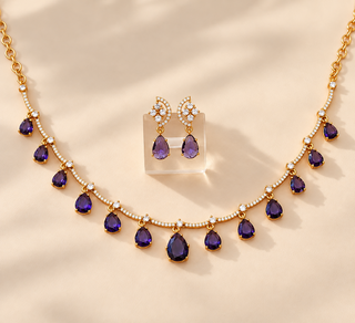Imogen purple CZ diamond necklace set gold finish with white cubic zirconia and matching 3 cm purple drop earrings