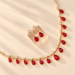 Imogen red gold finish Indian imitation necklace set with matching 3 cm earrings detail