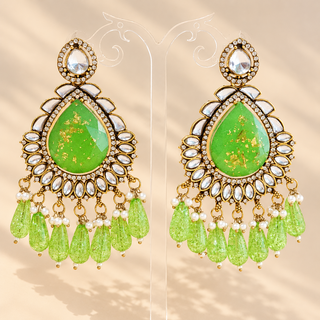 Lavinia green kundan chandelier earrings with green teardrop centre gold flecks clear stones and green bead drops on display
