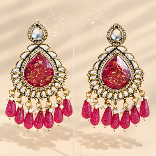 Lavinia rani pink kundan chandelier earrings 9 cm shown in hand with gold fleck pink stones and clear kundan accents