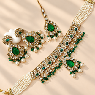 Mabel dark green kundan necklace set Victorian antique gold with matching earrings and maang tikka flat lay