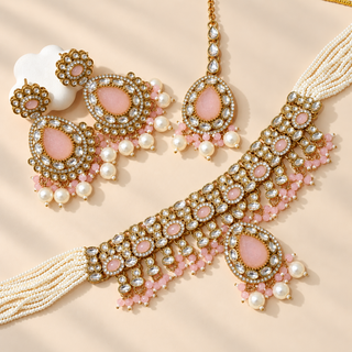 Mabel light pink kundan necklace set with earrings and maang tikka in Victorian antique gold finish