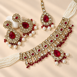 Mabel ruby red kundan necklace set antique Victorian gold with earrings and maang tikka flat lay
