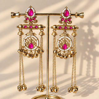 Ottilie hot pink Kashmiri earrings on gold display stand