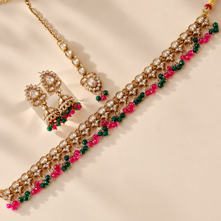 Raya dark green and rani pink polki necklace set with gold finish jhumka earrings and maang tikka